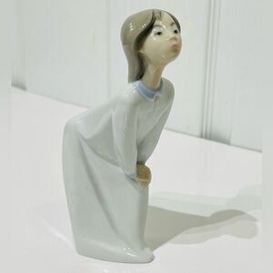Lladro Girl blowing kisses figurine- retired piece